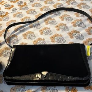 Etienne Aigner suede and leather shoulder with a flap front.  Good condition